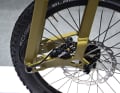 A mechanical disc brake stops the bike.