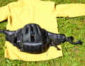A net hidden in the bottom of the bag secures the jacket or helmet on the outside.