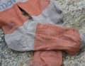 A few fibres come loose from the fabric on the instep...