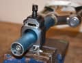 The saw guide is clamped in a vice - the fork steerer is in the guide.