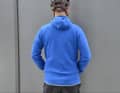 The fleece jacket has a relatively long cut and is not excessively tight.