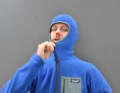 The hood completely covers the editor's head.