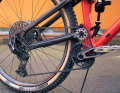 The high main pivot point of the Kavenz bikes increases the distance between the bottom bracket and the rear wheel axle during compression, causing the rear wheel to swerve backwards towards the obstacle instead of getting "stuck" on it.