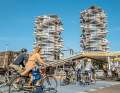 The journey to work becomes a sightseeing tour: cyclists ride past the city's architectural highlight, the Kaktus Towers.
