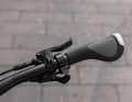 The ergonomically shaped handles with integrated bar ends are designed to prevent discomfort in the hands and arms.