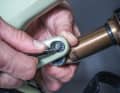 REMOVING THE BOLTS: After loosening the Allen screw, carefully pull out the connecting bolt between the damper and the linkage. 