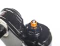 While the negative chamber fills automatically on most forks, you have to press a button on the Cane Creek to equalise the pressure.