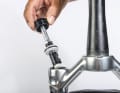 The air chamber size of the Manitou R7 can also be adjusted without volume spacers/tokens. Small clips are used to move the position of the separating piston.