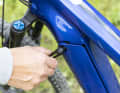 The battery cover can be opened with an Allen key. This travels in the rear thru axle and is therefore always on the bike.