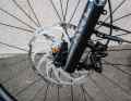 The 203 mm diameter Shimano disc grips crisply and with good modulation.