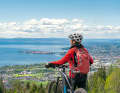 Cycle tour Lake Constance: In the distance, this cyclist can see the Swiss mountains from the shores of Lake Constance.