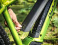 The battery is inserted into the top tube from above.