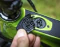 The charging port is easily accessible on the top tube.