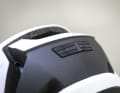 To prevent the goggle from slipping off the helmet, it is held in place by a rubber coating on the back