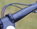 The discreet black look of the OneUp carbon handlebars can be customised with stickers.