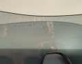 The scratches are clearly visible against the light, but are not visible when worn as they are behind the frame.