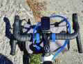 A good combination of stowing the water on the bike and still being able to drink while cycling without having to juggle bottles.