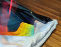 The version with a black frame and Laser Red lenses has a rather dark, bluish-green tint.