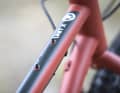 On the top tube of the Kona Unit X there is a mounting point for a fixed bag.