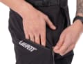 A thigh pocket with zip and a back pocket with Velcro fastening offer secure storage space.