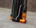 When the stand is folded in, the pump head can be fixed in the holder