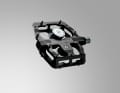 The large pedal body is CNC-milled from an aluminium block