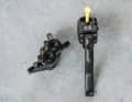 The yellow cap holds the mineral oil in the filled lever.