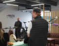 Designer Peter "Stretch" Zawistowsk talks about the new bike (hidden because we're not allowed to show it yet). The TQ delegation listens. Left in the picture: Bella Chen.