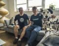The Klausmanns on the sofa at home with the family dog.