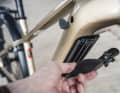 The 800 watt-hour battery is secured with a key and practically folds forwards out of the down tube.