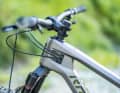 All cables are neatly routed and clamped into the frame on the left side of the head tube.