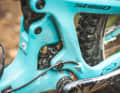 With Yeti's patented Switch Infinity Link, the main pivot point is clamped to two pistons that move up and down a few millimetres during compression. This virtual pivot point changes its position as the suspension compresses, and the engineers can optimise the anti-squat and anti-rise values for individual suspension travel ranges.