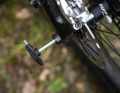 There is a hexagon socket in the rear thru axle, which also serves as a quick-release replacement.