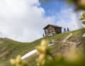 Once you reach the Chörbschhornhütte at an altitude of just under 2600 metres, the route continues downhill in Alpine meadow switchbacks.