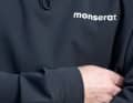In the plain design, only the discreet "Monserat" lettering can be seen on the chest.