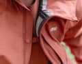 Clever detail: to prevent the jacket from flapping when open, it has a small fastening with a press stud.