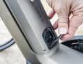 The charging port is located on the down tube. The cover also functions as a toggle switch for unlocking the battery cover.