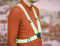 A high-visibility waistcoat or reflective belt is particularly easy for drivers to see.
