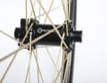 The Vectran spokes require special hubs. These come from Newmen.