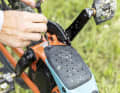 The battery is housed under a cover that can be unscrewed from the bottom.
