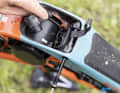 To remove the battery, the power supply must be disconnected and a bolt removed.