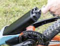 The 726 Wh battery can be pulled out from the bottom of the closed down tube.