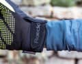 The cuffs can be adjusted easily, but are short. A jacket with long sleeves is a must here