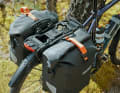 Two side panniers can be attached to the pannier rack with a click system.
