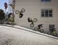 Danny performs spectacular stunts like this front flip on the streets of San Francisco on his trial bike.