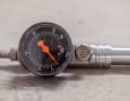 The pressure gauge would be large enough, but the psi scale is inconveniently located on the inside