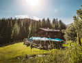 The Spielberghaus is situated in a secluded location on an alpine meadow between the Salzburger Land and Tyrol.