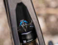 The two-part top tube allows a view of the platform position on the rear shock and...
