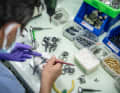 The countless small parts of the gearstick are assembled by hand.