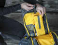 In addition to a brightly lined main compartment with battery holder ...